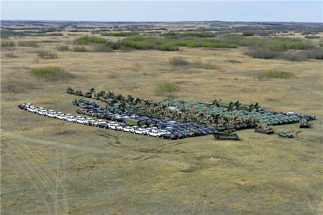 Aerial photo of the Canadian Maneuver Training Centre Operations Group and the scale of resources required to deliver Exercise MAPLE RESOLVE including all available attachments, augmentees, vehicles and equipment at Saville Farm, Wainwright training area on April 29, 2015. Cpl True-dee McCarthy, Wainwright Imagery Section WT2015-0053-04